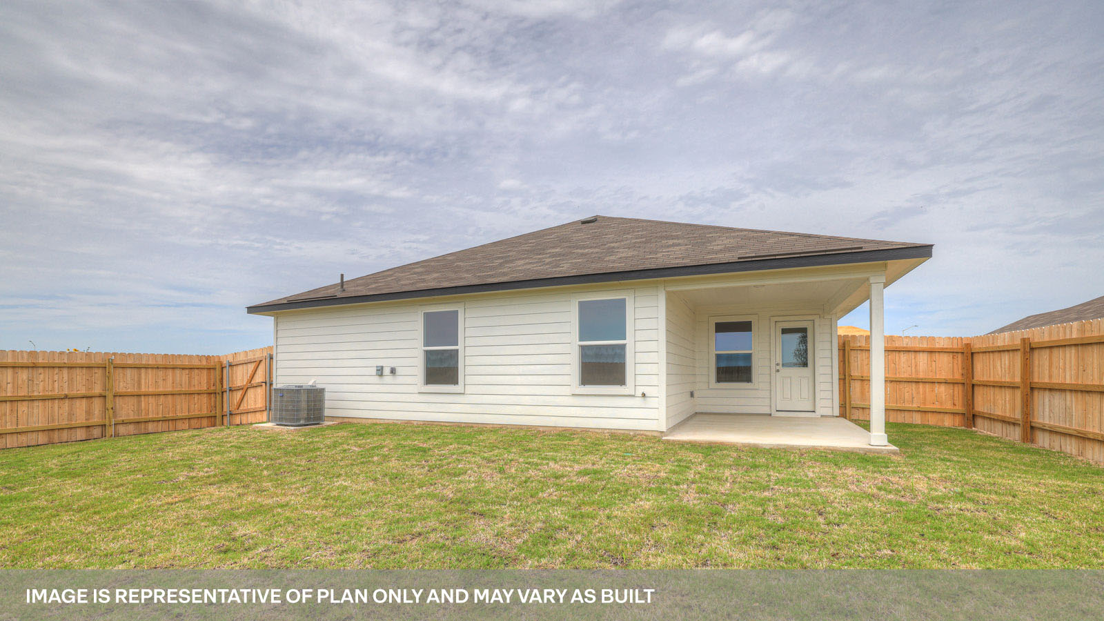 Covered patio with fully sodded backyard and privacy fence.