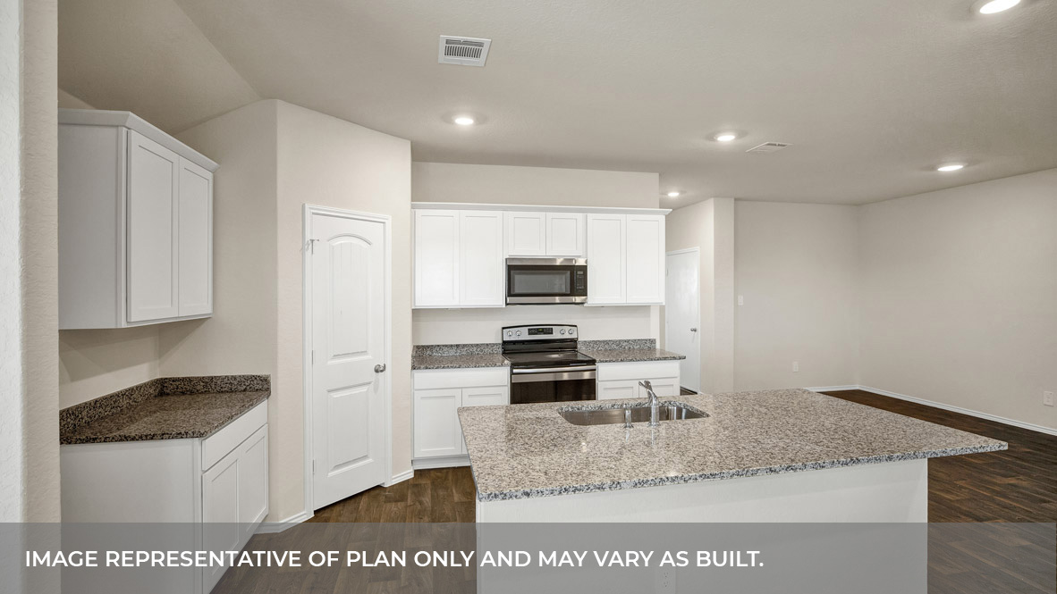 Kitchen with kitchen island and white cabinets.