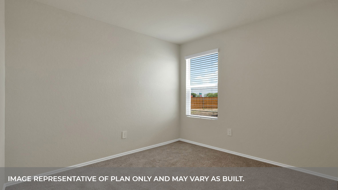 Secondary bedroom with carpeting and one window.