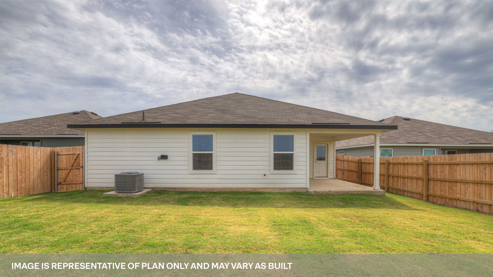 Covered patio with fully sodded backyard and privacy fence.