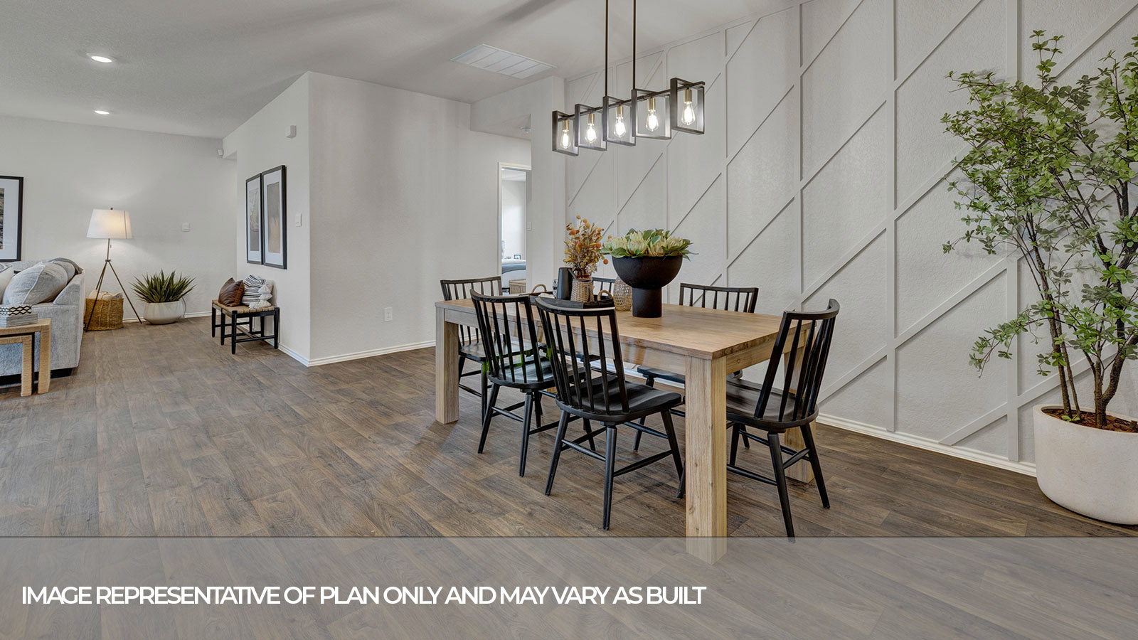 Dining room with vinyl flooring and bedroom hallway.