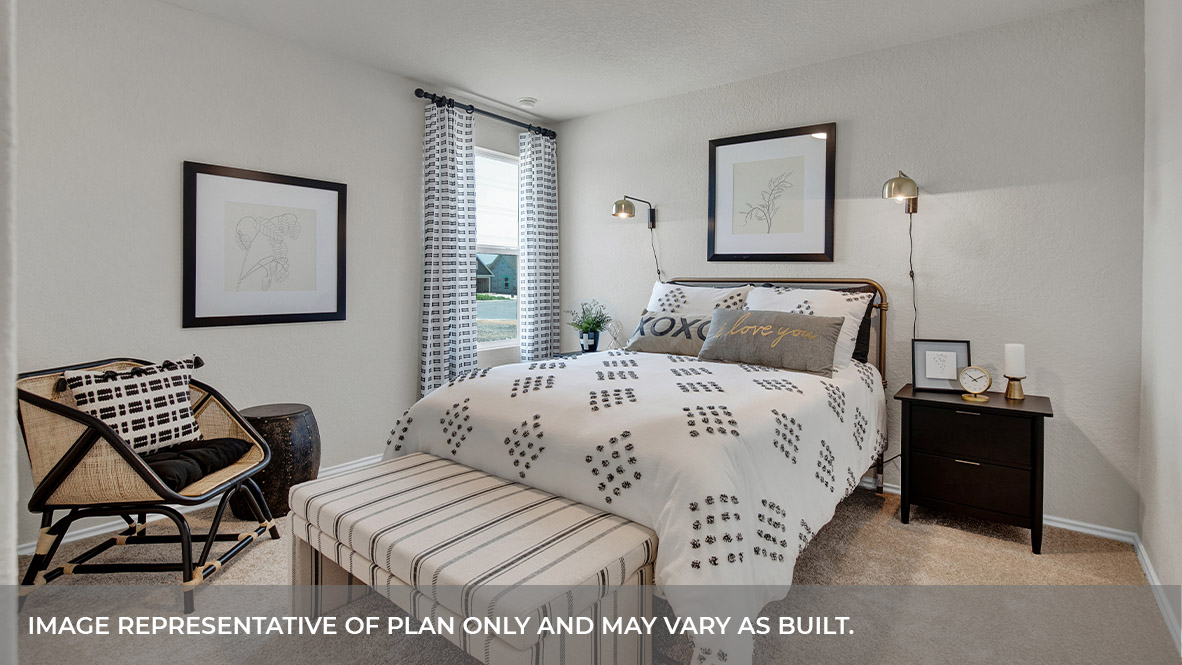 Bedroom with carpeting and one window.