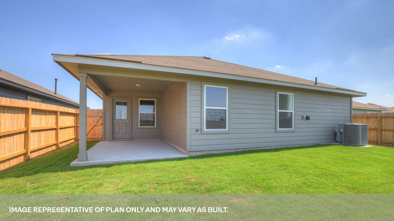 Covered patio with fully sodded backyard and privacy fence.