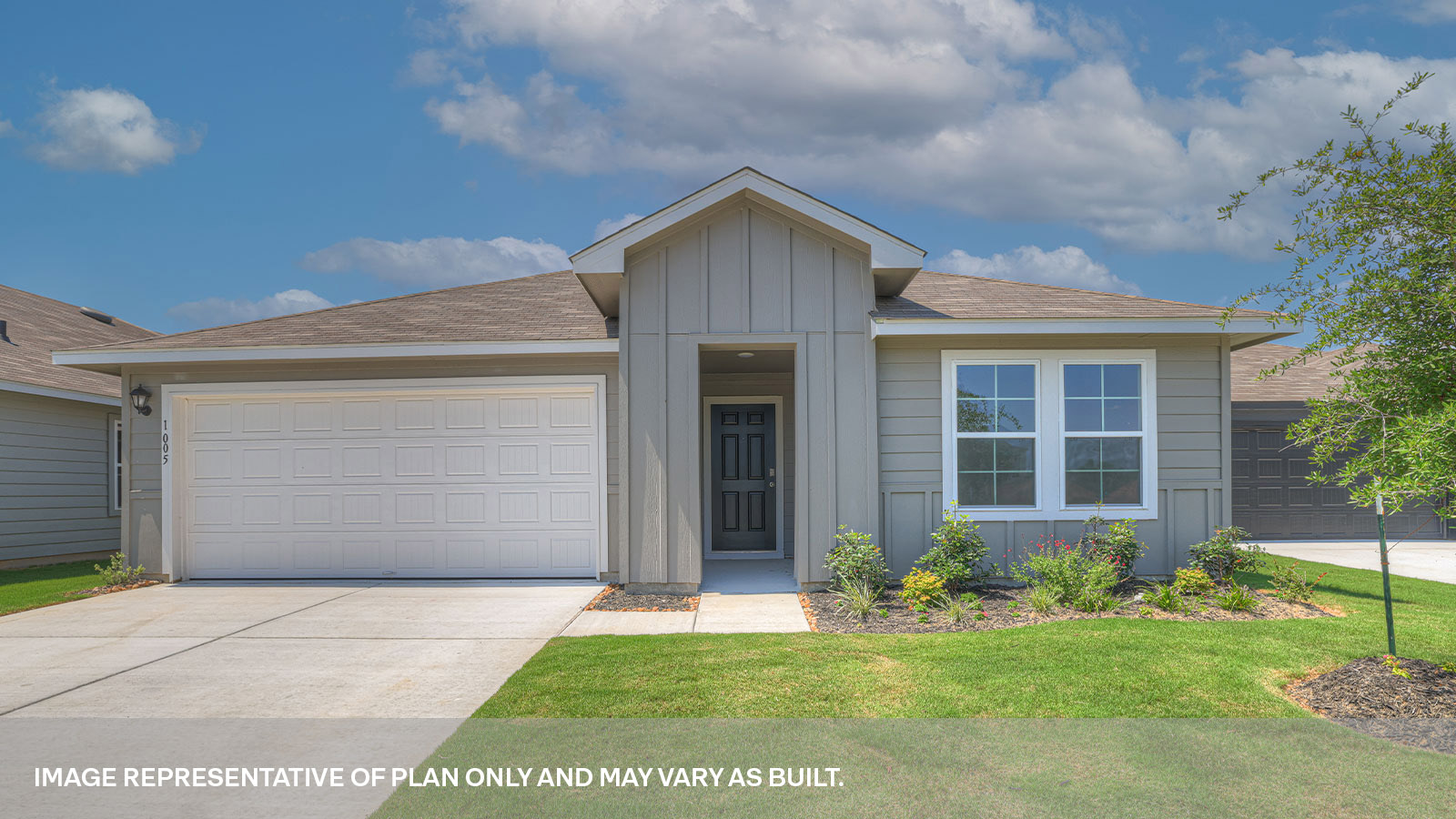 Single-story farmhouse with 2 car garage.