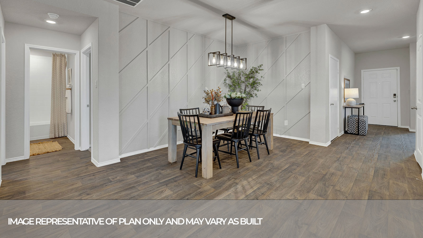 Dining room with vinyl flooring and entry hallway.
