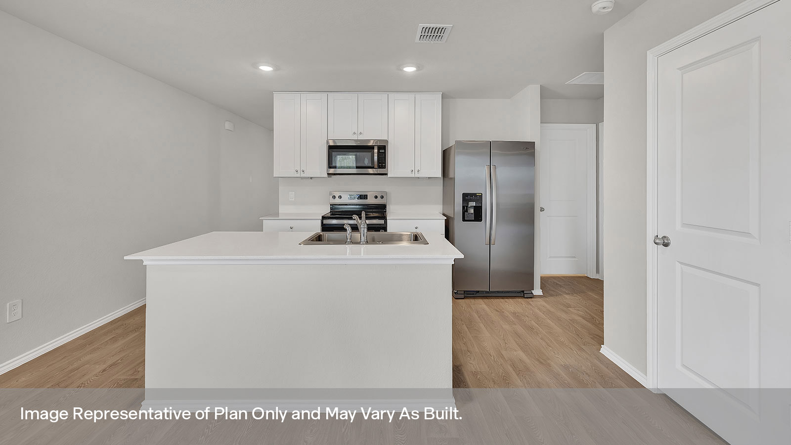 Kitchen with kitchen island and white cabinets.
