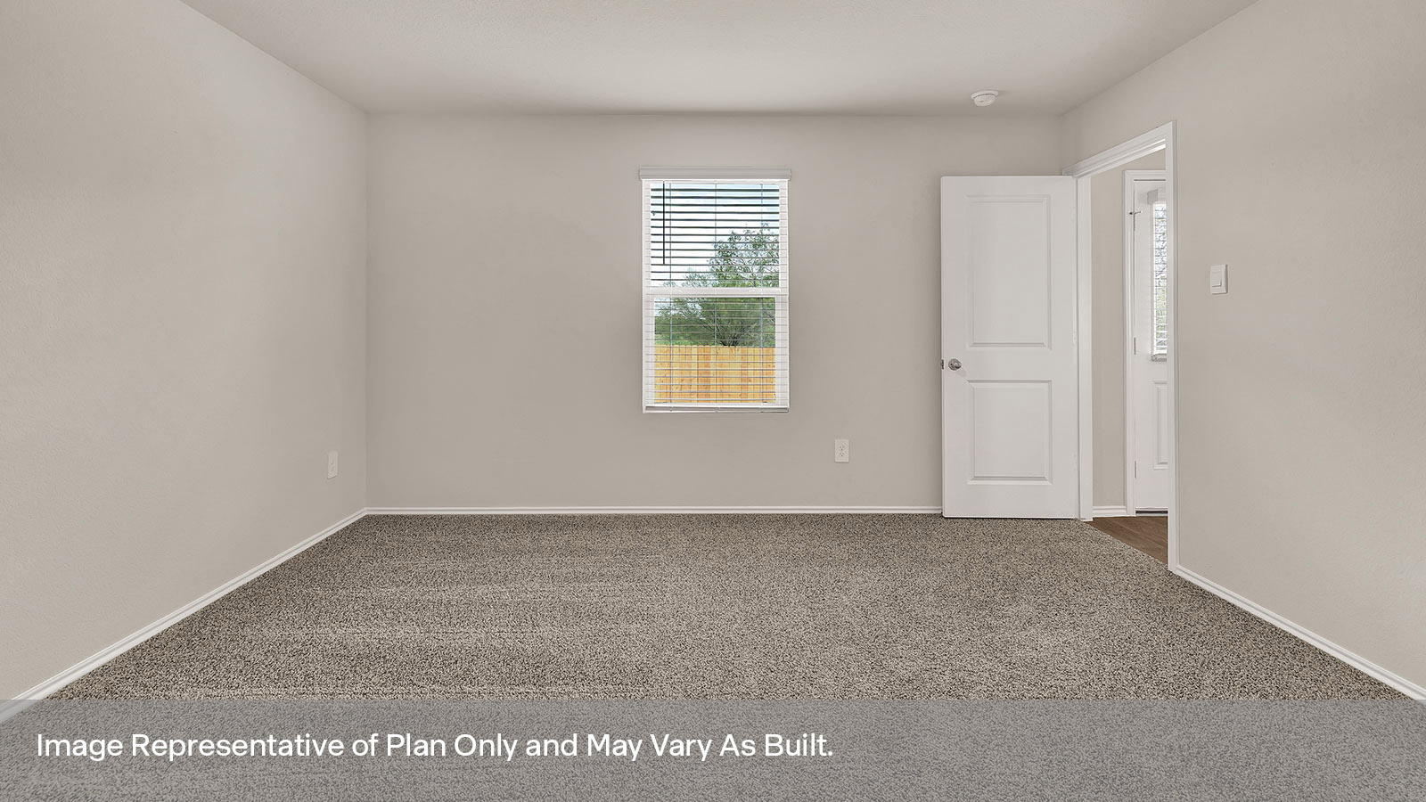 Main bedroom with carpeting and one window.