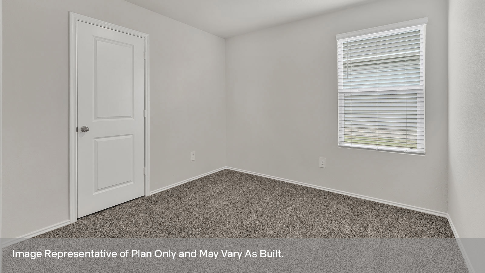 Secondary bedroom with carpeting and bathroom entry.
