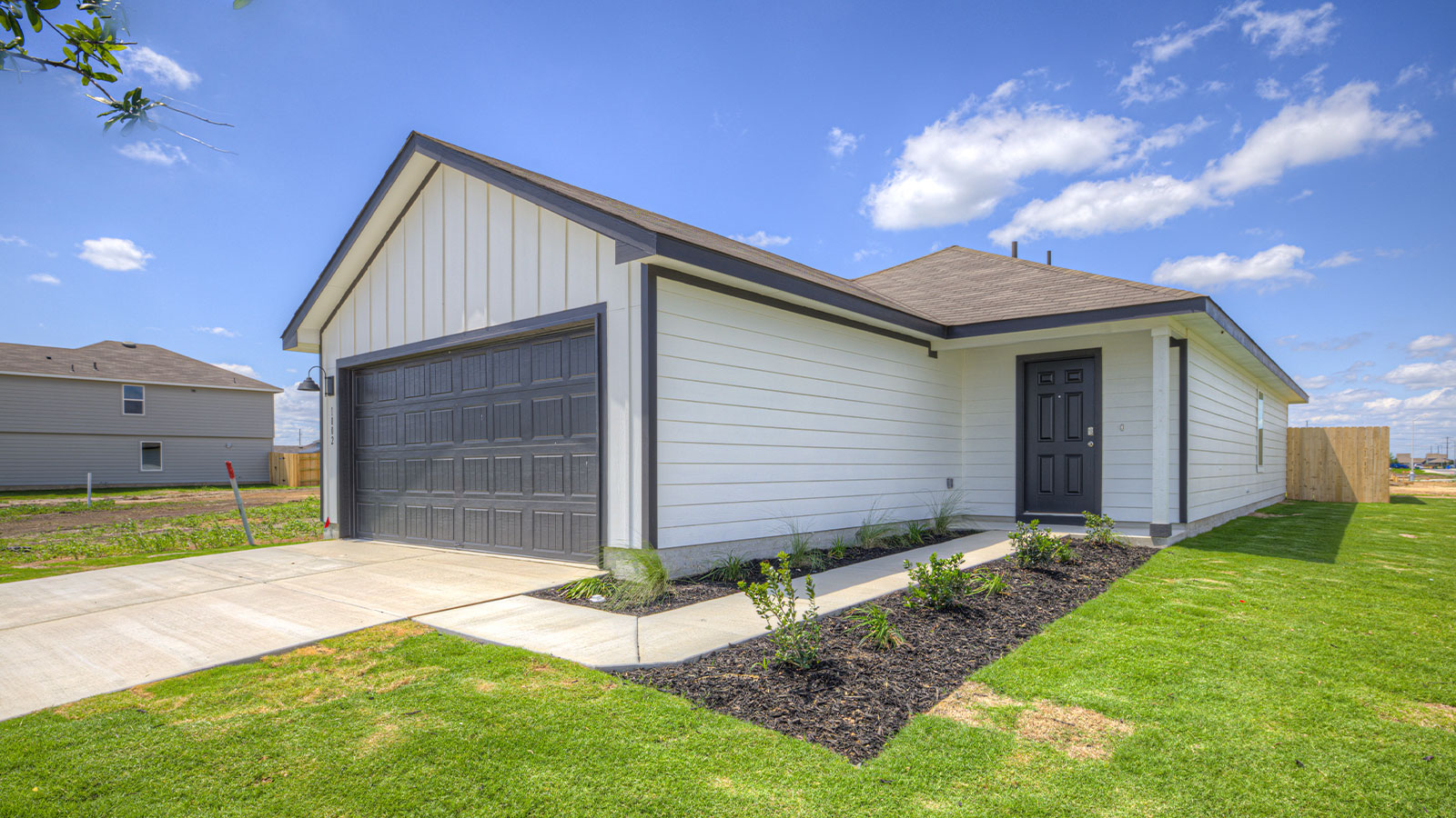 Siding Exterior, Garage Forward with a wrap around Sidewalk