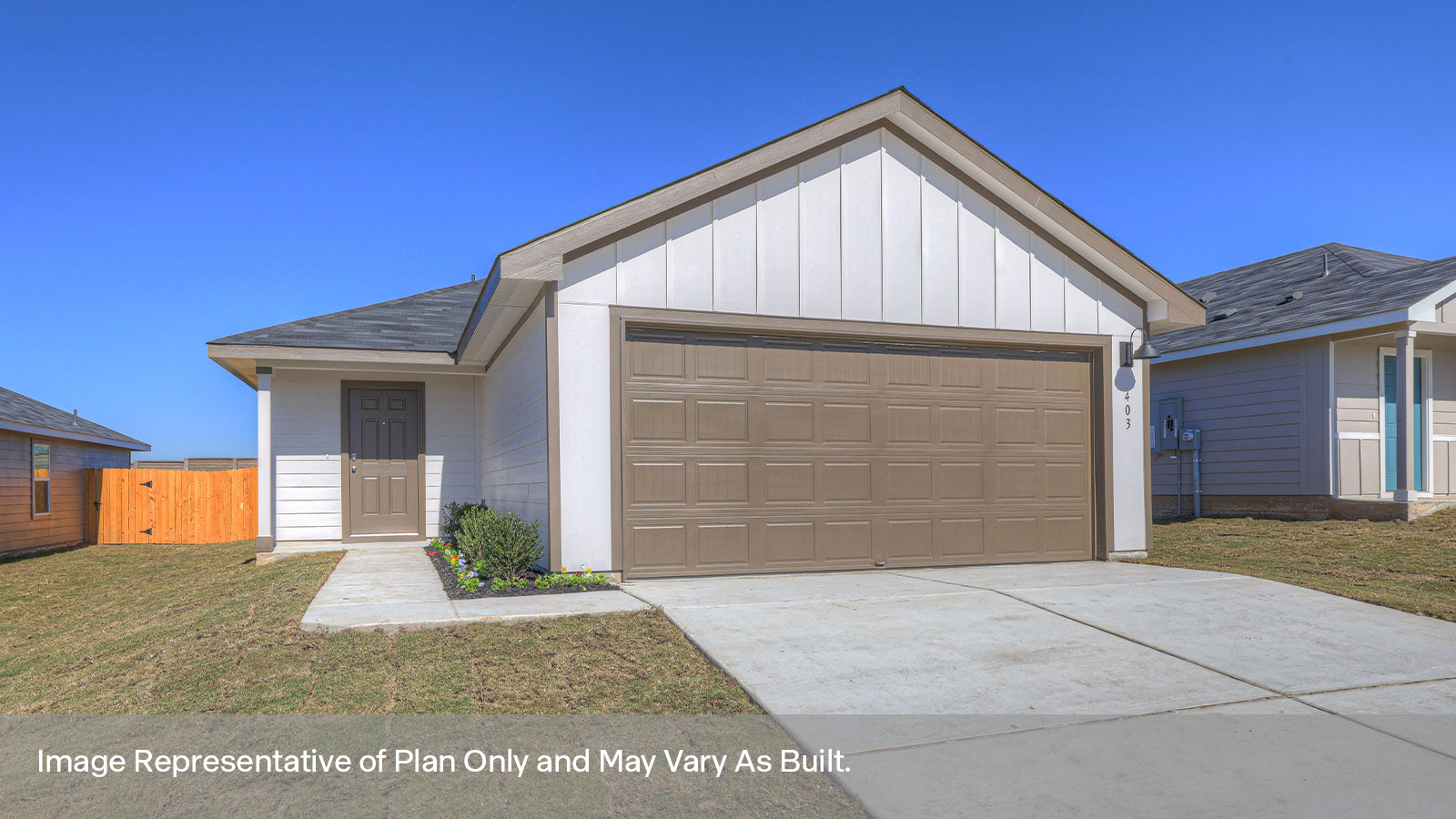 Single-story farmhouse with 2 car garage.