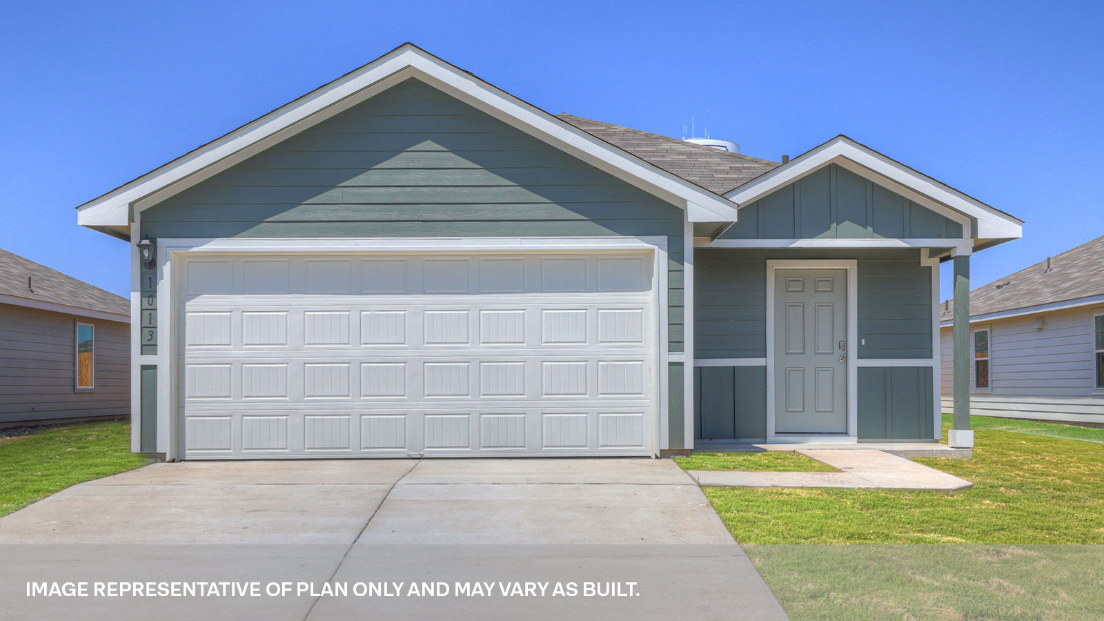 Single-story farmhouse with 2 car garage.
