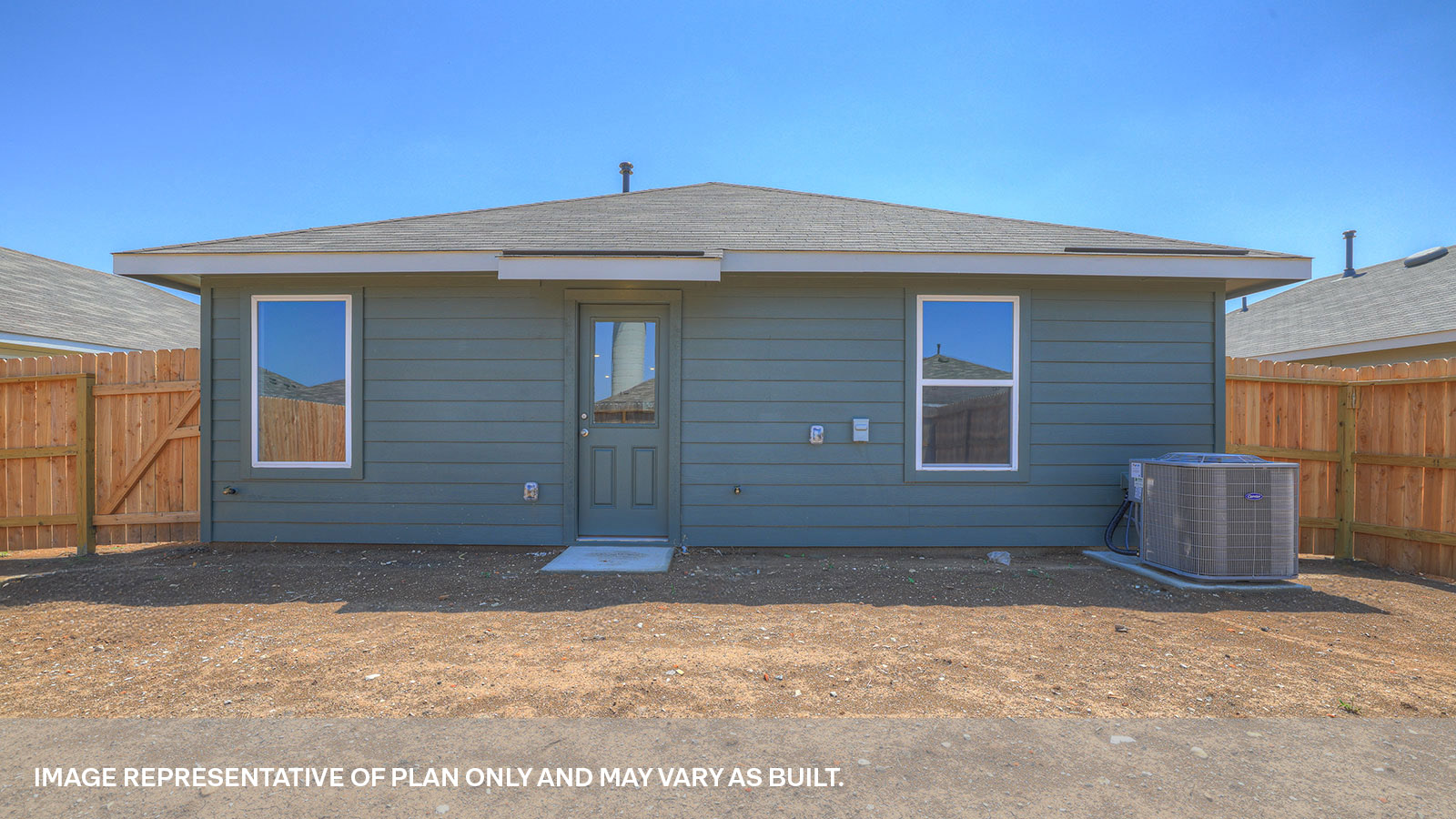 Backyard with sod and privacy fence.