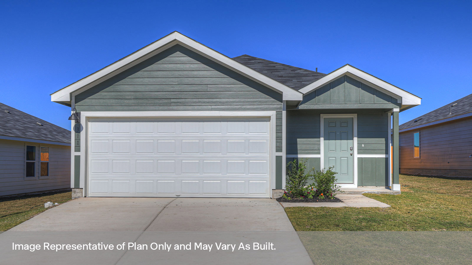 Single-story farmhouse with 2 car garage.