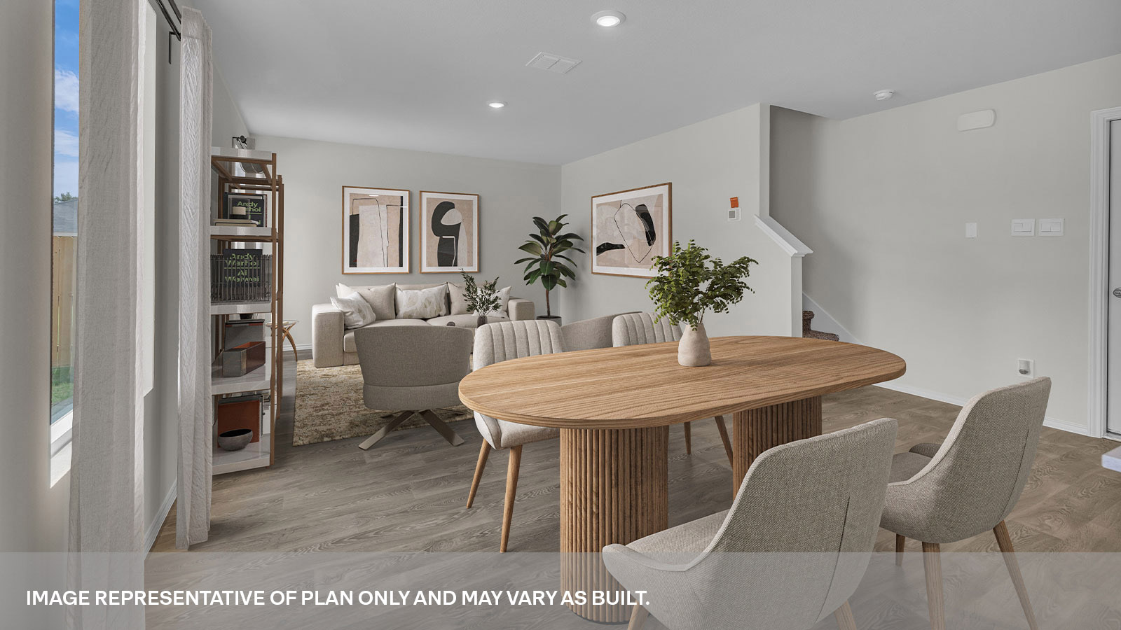 Virtually staged dining room with table and chairs opening to the living room.
