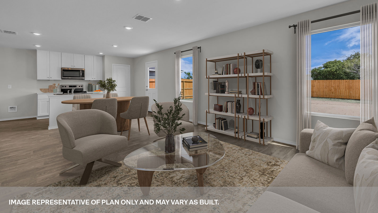 Virtually staged living room with a couch, coffe table, and bookshelf.