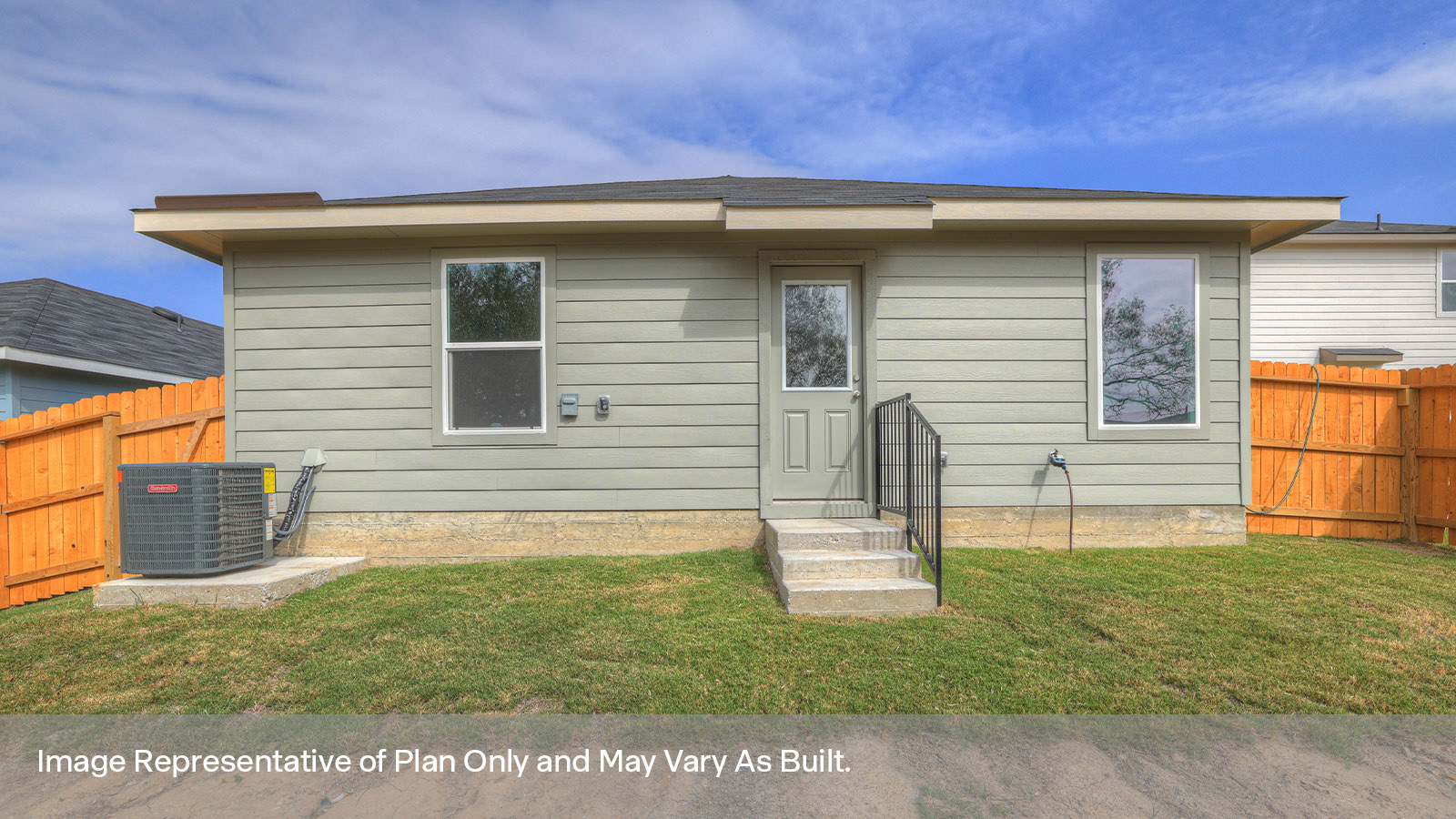 Backyard with 2 windows, and a half lite exterior door.
