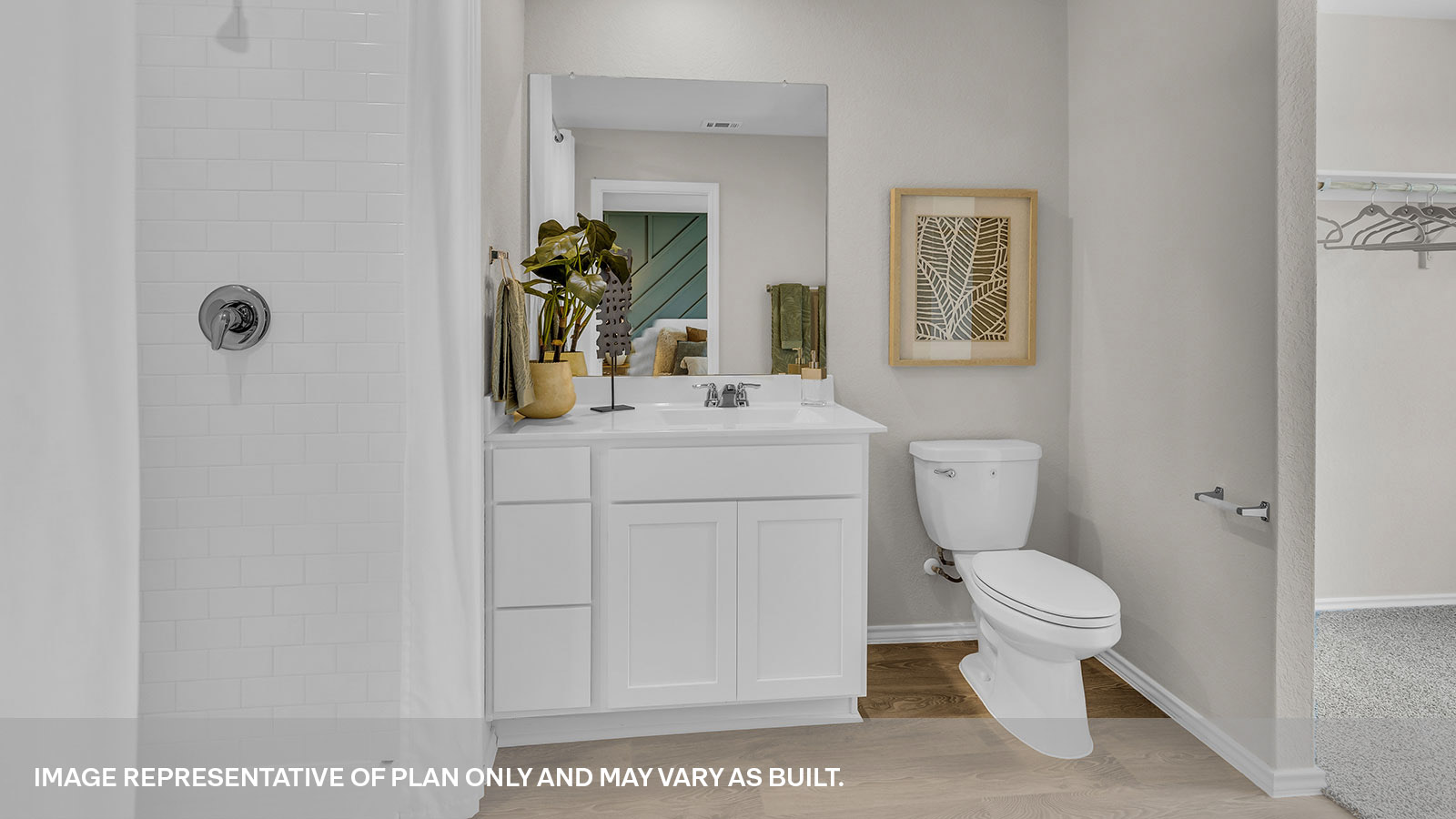 Main bathroom with toilet, walk-in shower, and vanity.