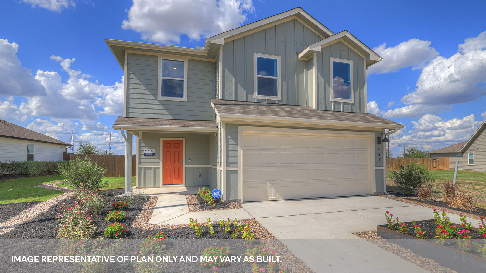 Two-story farmhouse exterior with 2 car garage.