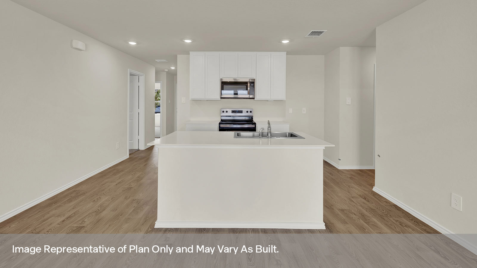 Entry hallway leading to the kitchen with kitchen island.