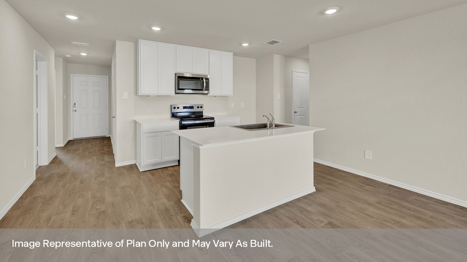 Kitchen with kitchen island and white cabinets.