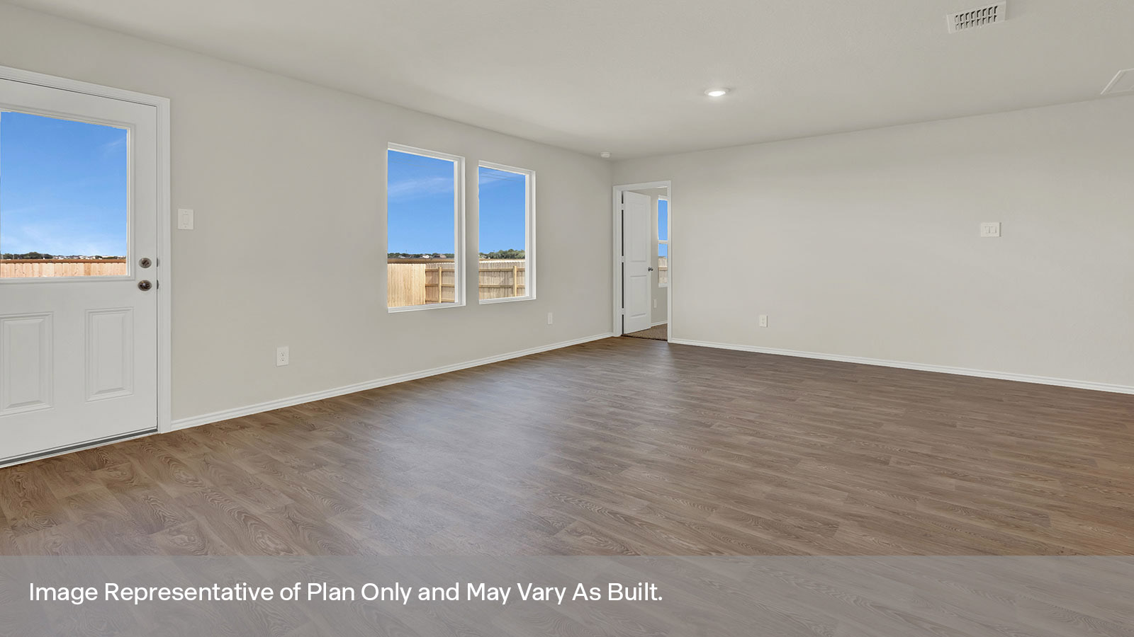 Dining room with vinyl flooring and a half lite exterior door.