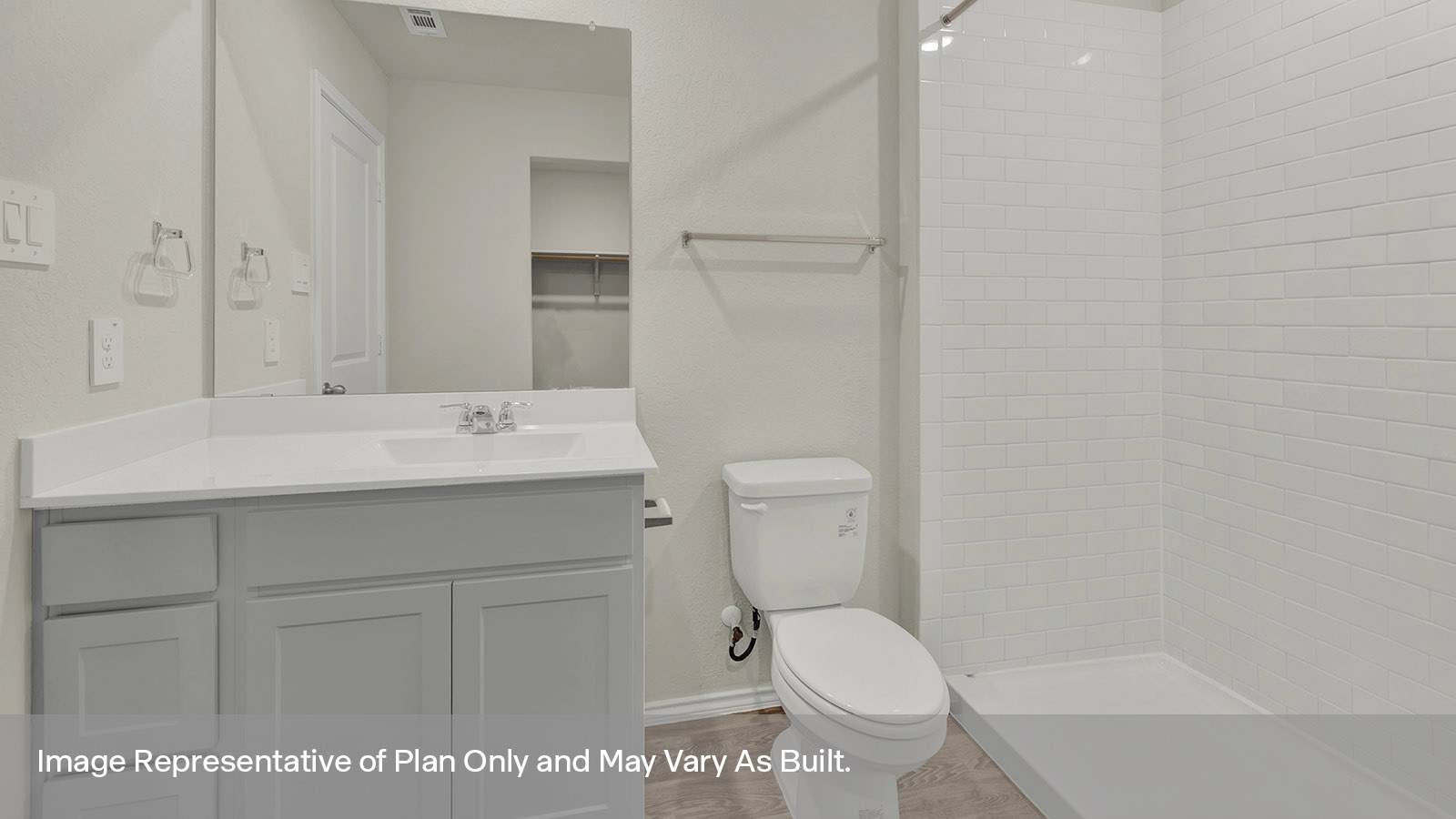 Main bathroom with vanity, toilet, and shower.