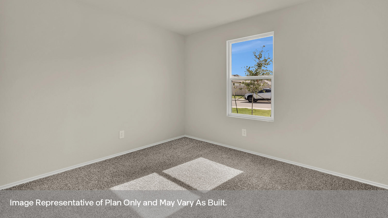 Front bedroom with carpeting and one window.