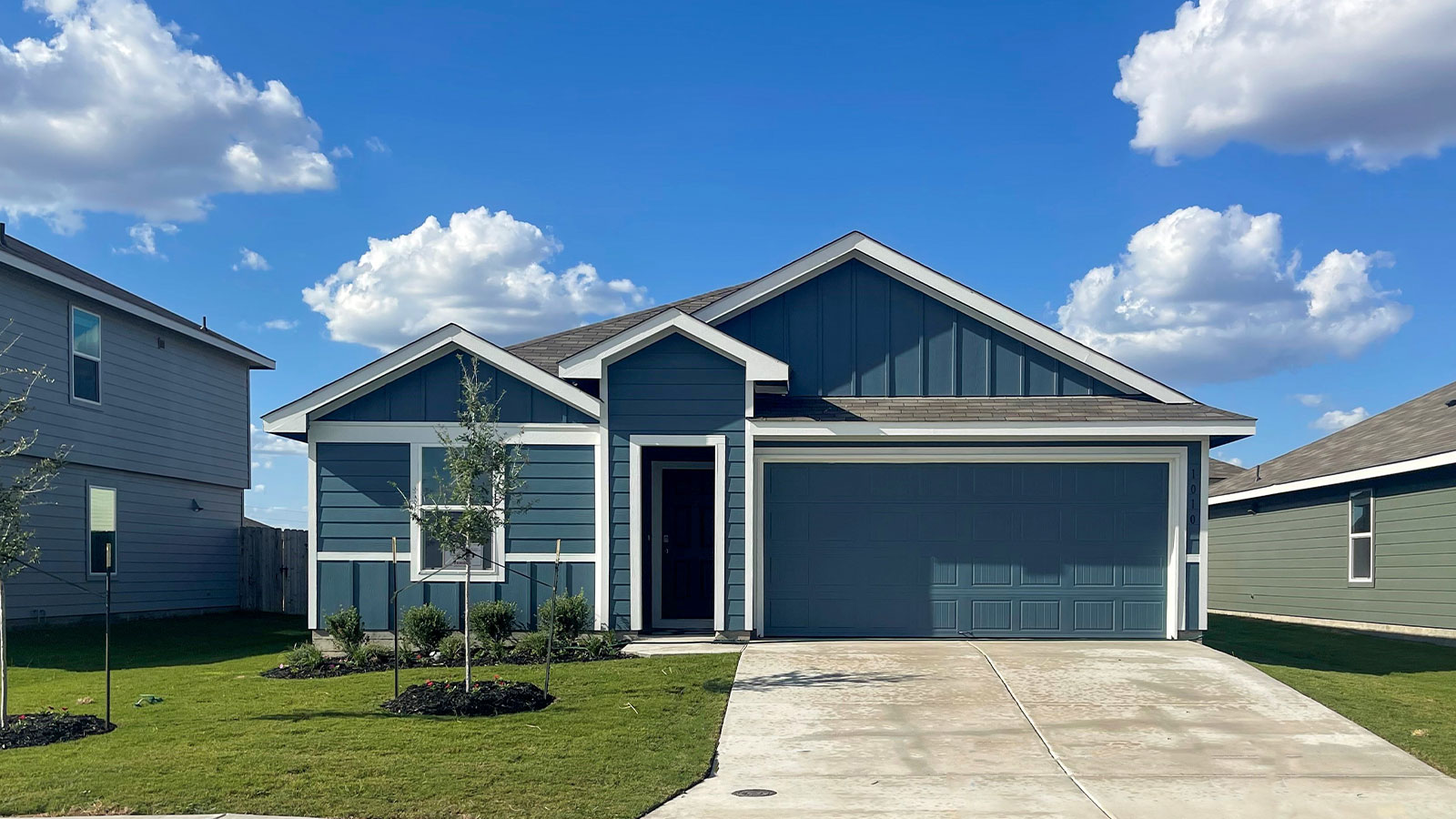 One-Story farmhouse exterior with two-car garage.
