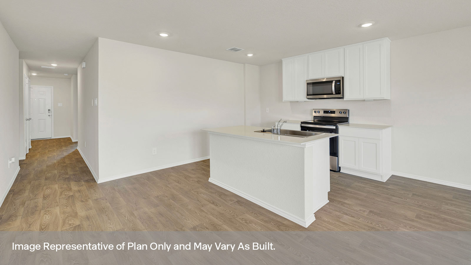 Entry hallway leading to the kitchen with kitchen island.