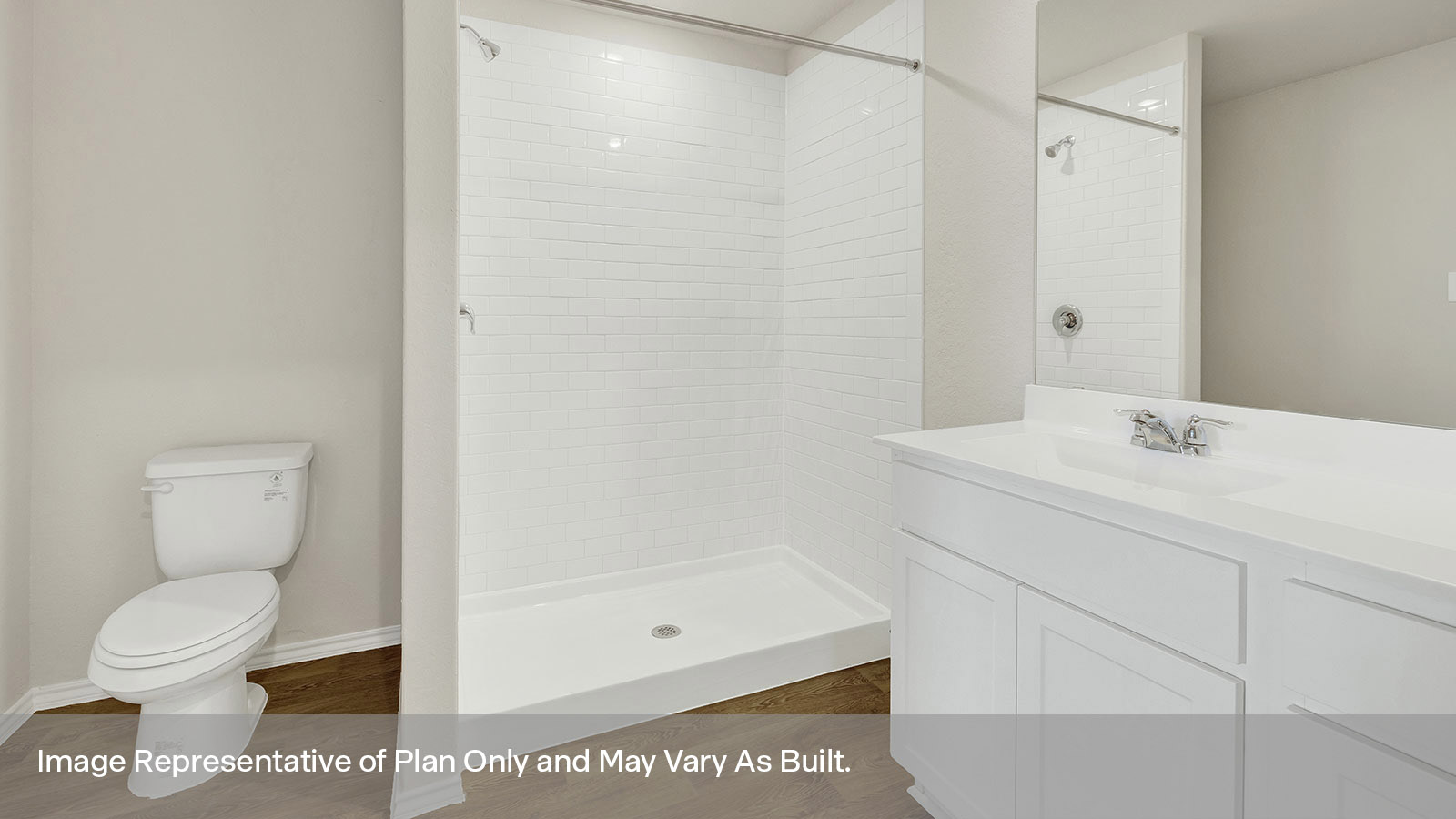 Main bathroom with vanity, toilet, and shower.