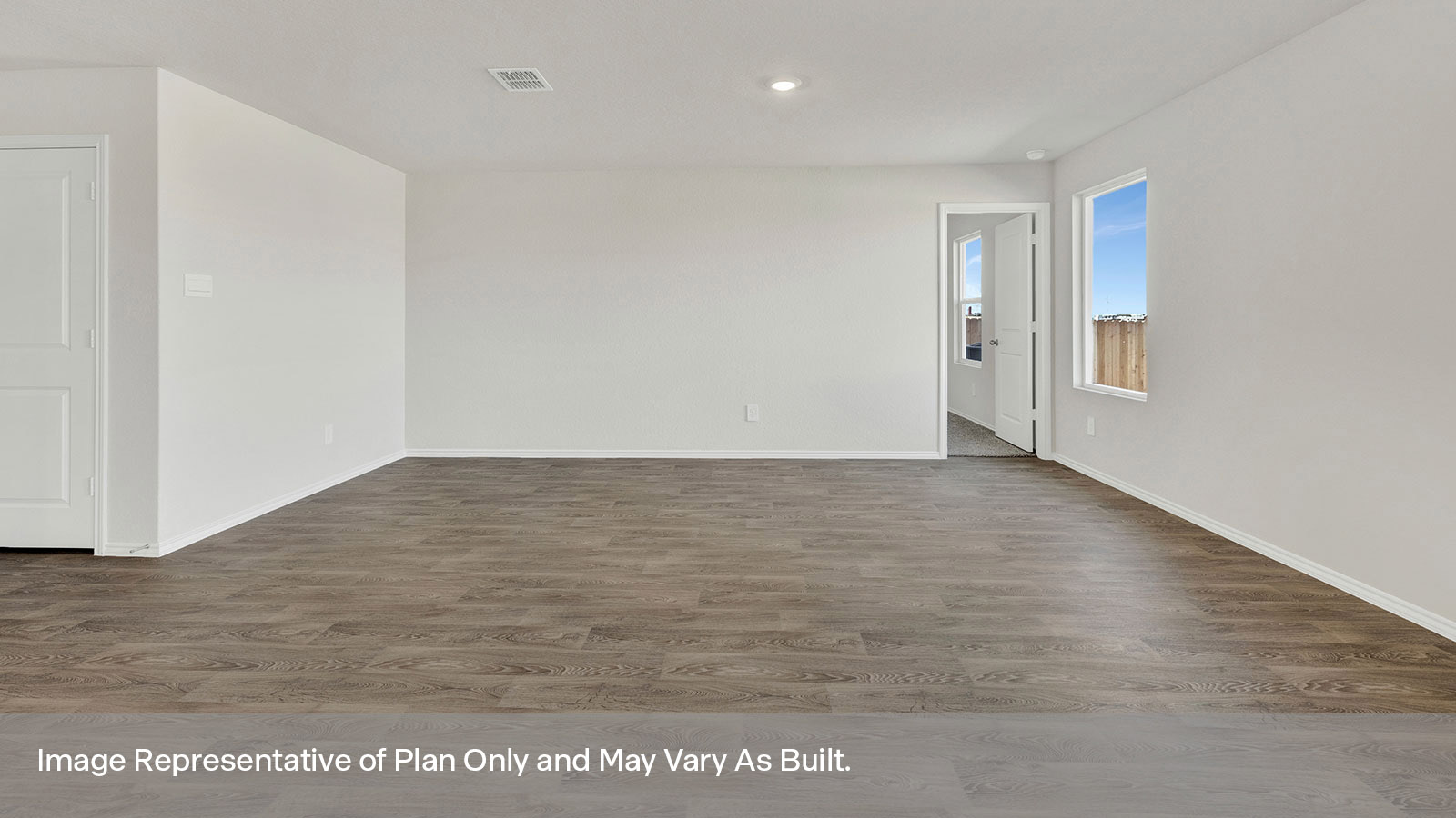 Living room with vinyl flooring and one window.