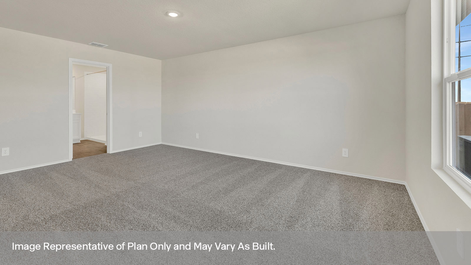 Main bedroom with carpeting and one window.