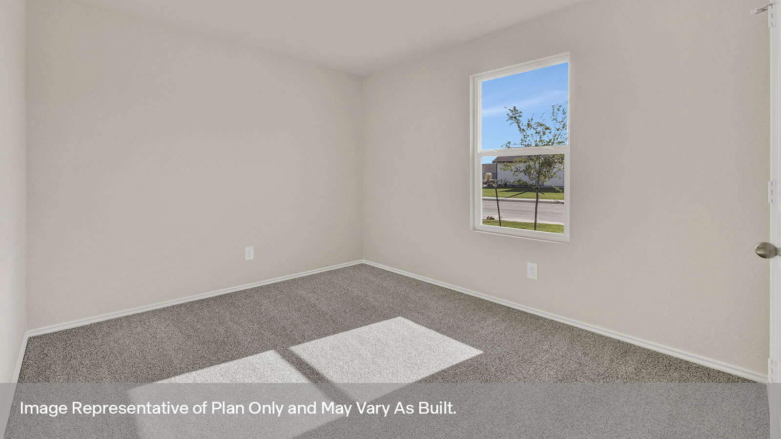 Front bedroom with carpeting and one window.