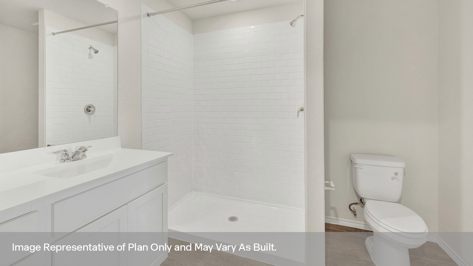 Main bathroom with toilet, vanity, and shower.