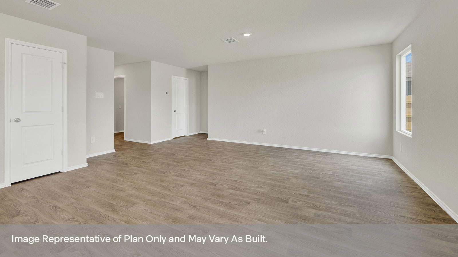 Living room with vinyl flooring and hallway to front of home.