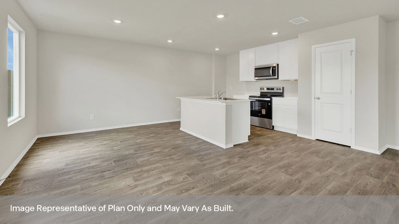 Kitchen with island and white cabinets.