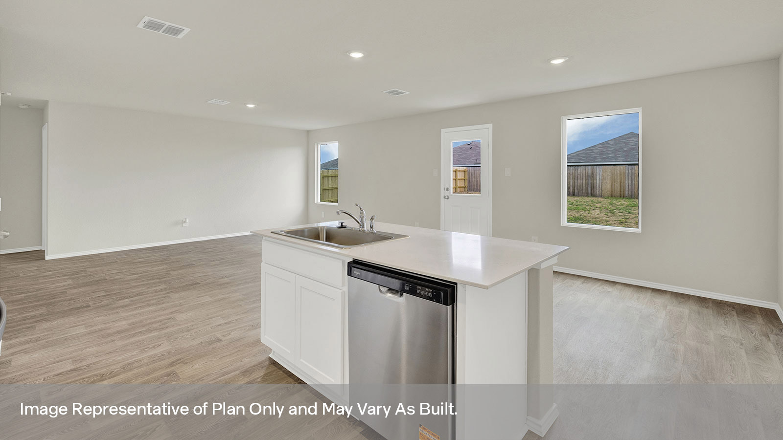 Kitchen overlooking dining room and living room.