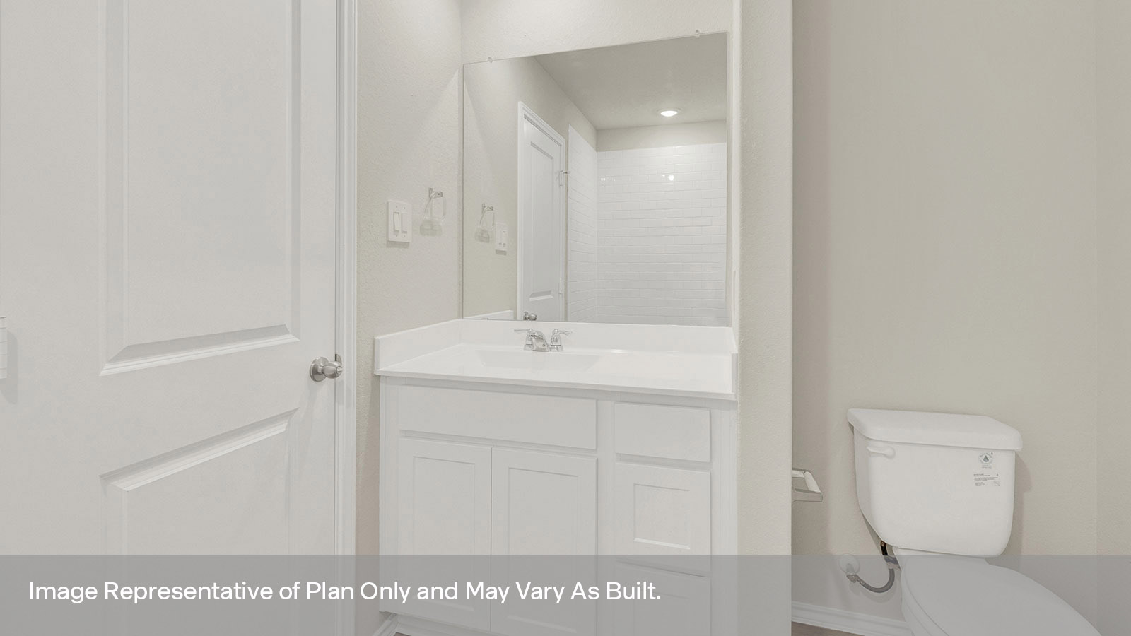 Main bathroom with toilet and vanity.