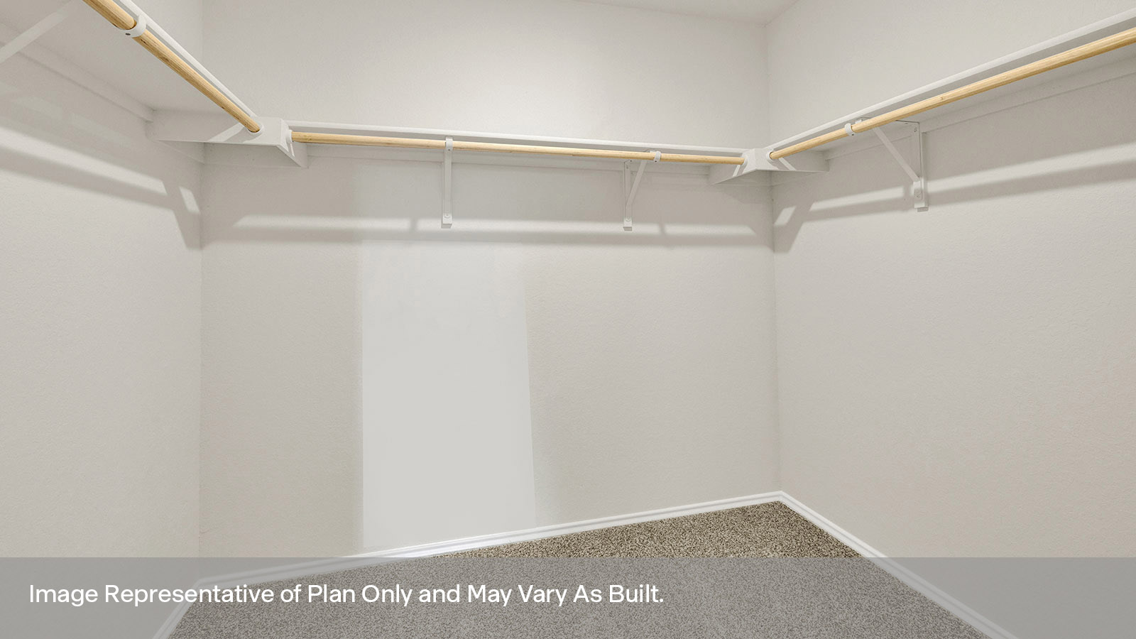 Main bedroom closet with wood shelving.