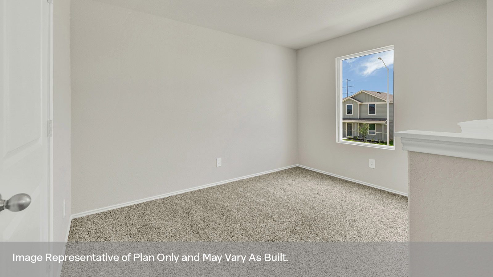 Secondary bedroom with carpeting and window.