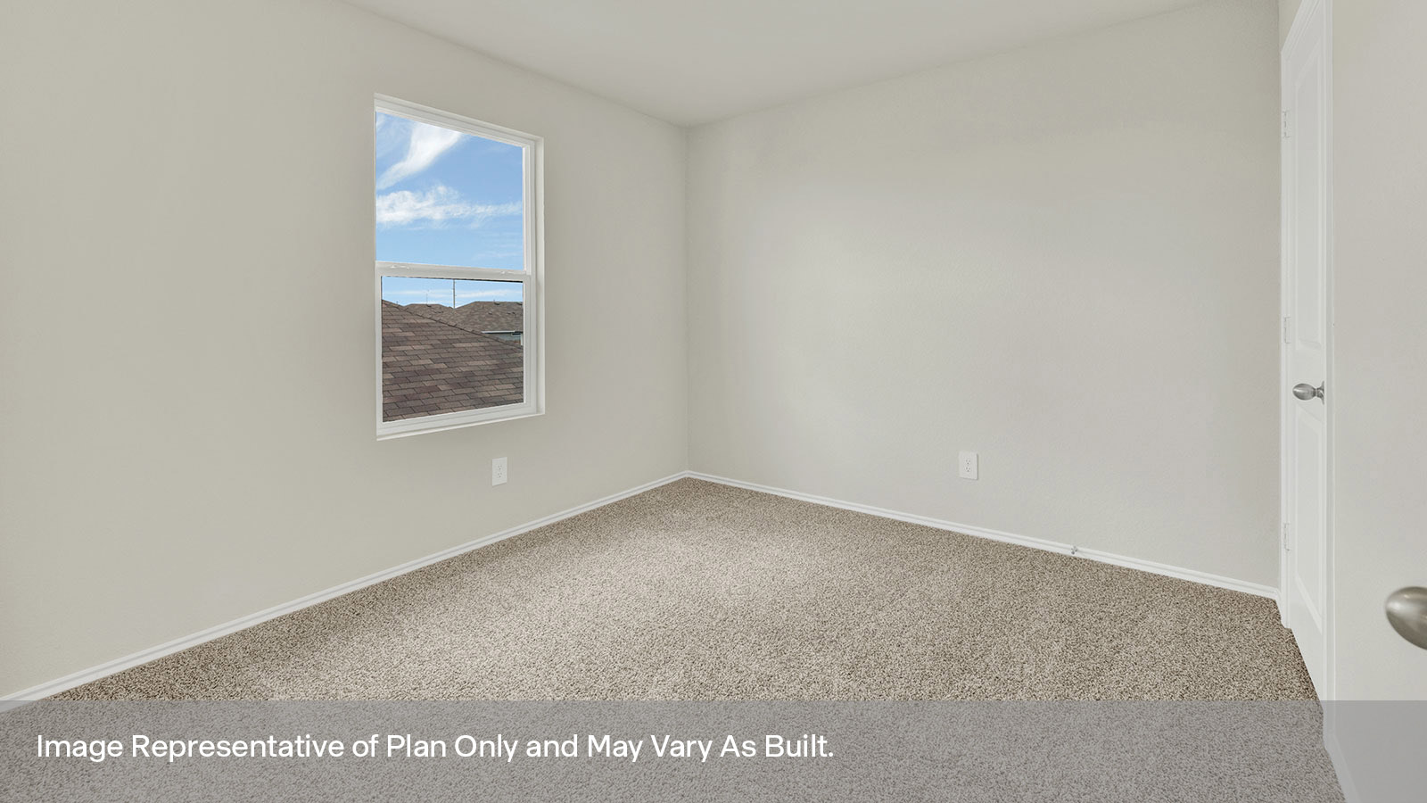 Secondary bedroom with carpeting and window.