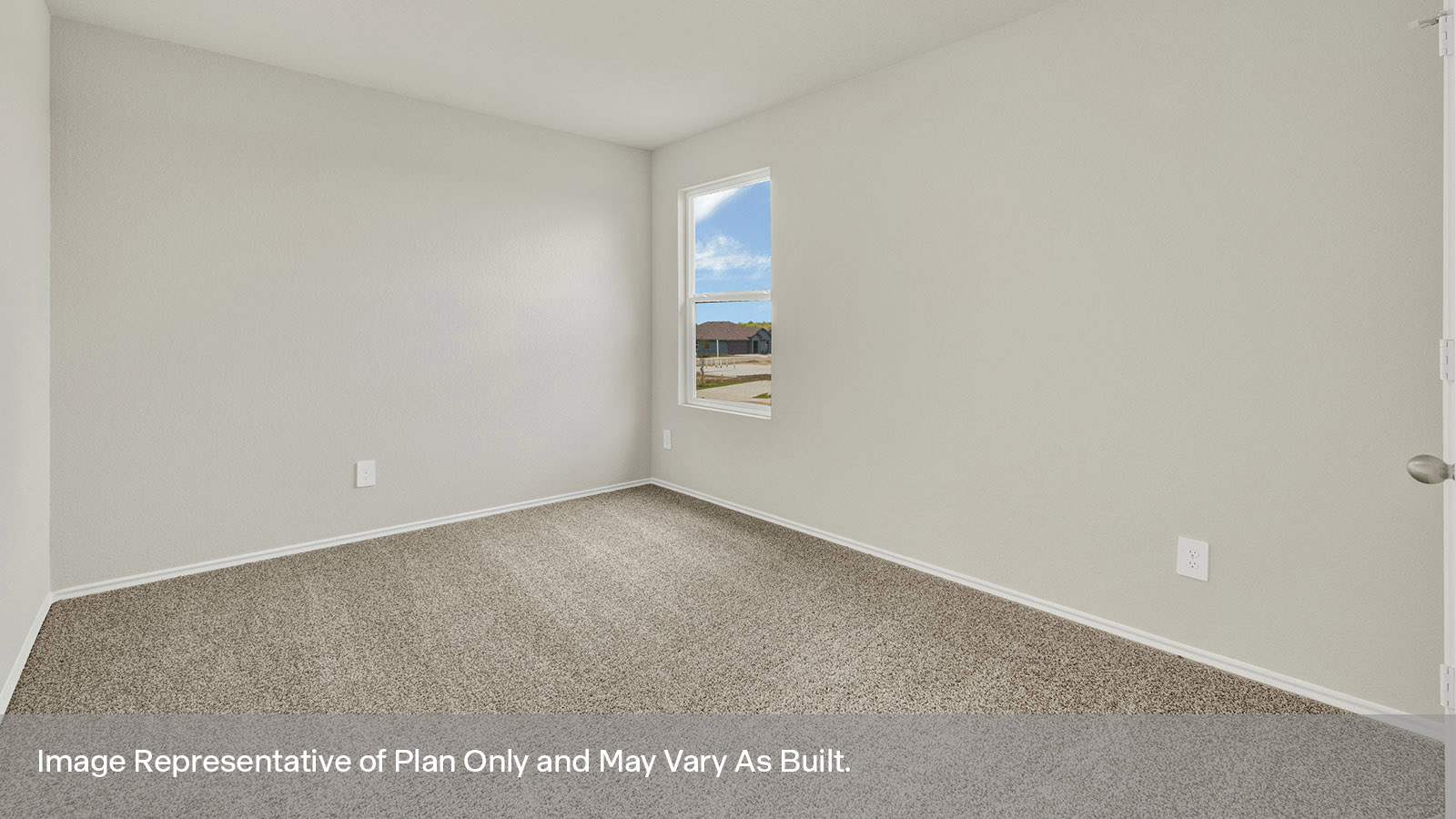 Secondary bedroom with carpeting and window.