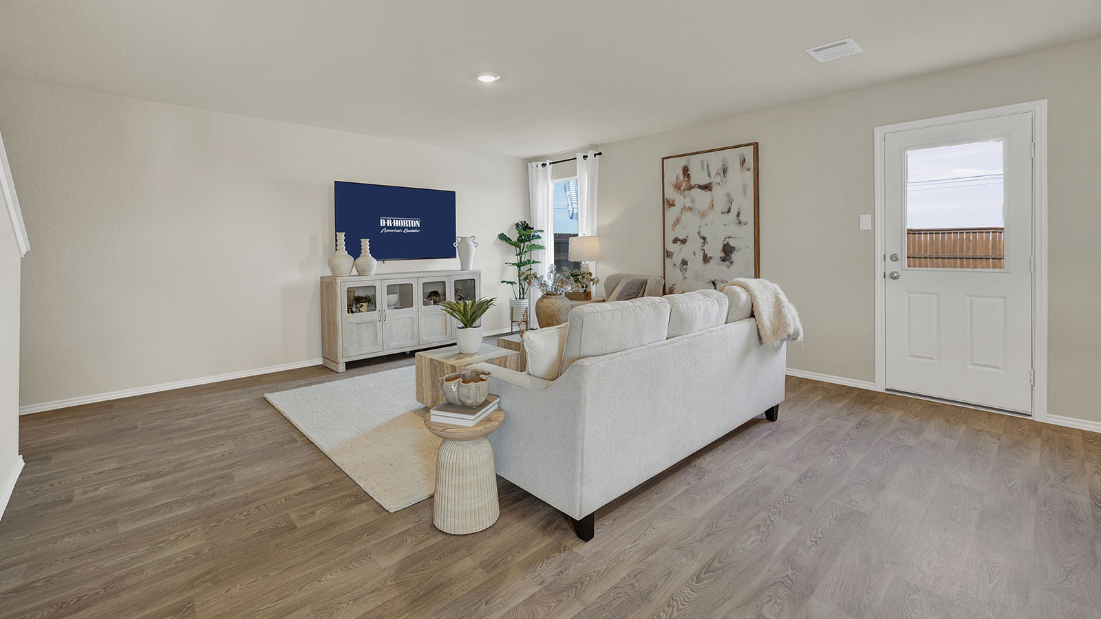 Living room with vinyl flooring, one window, and a half lite exterior door.
