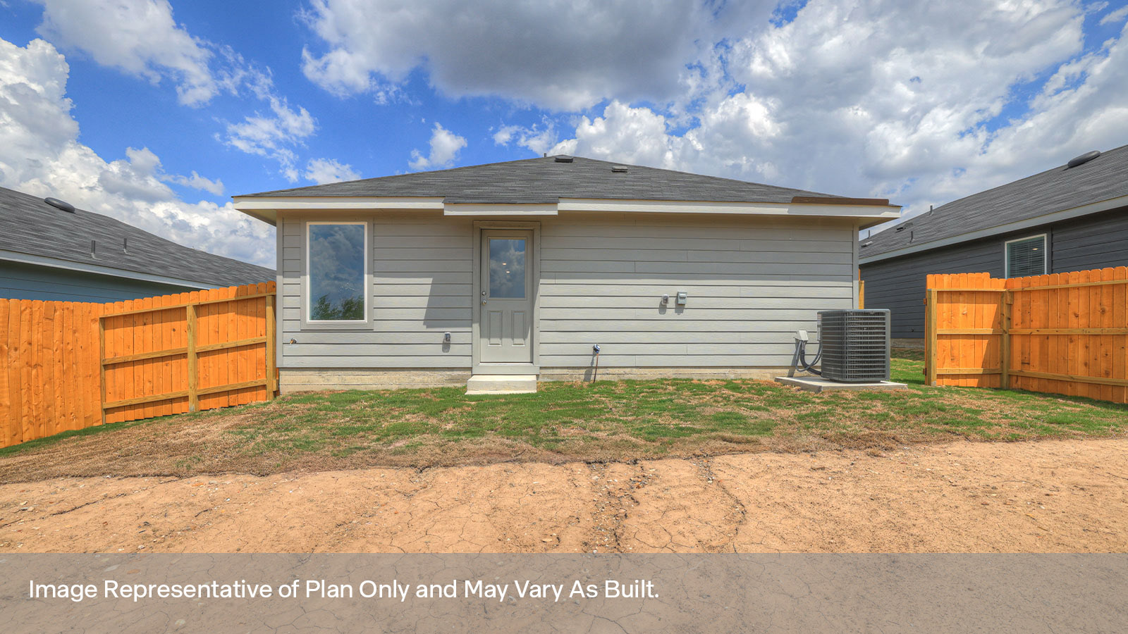 Backyard with sod and privacy fence.
