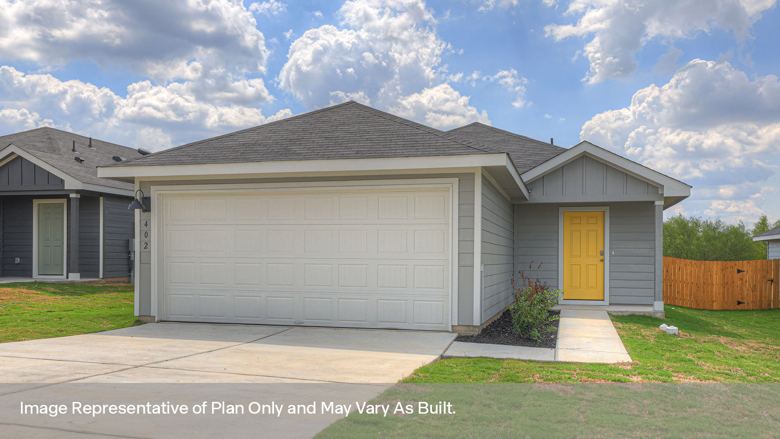 Single-story farmhouse with 2 car garage.