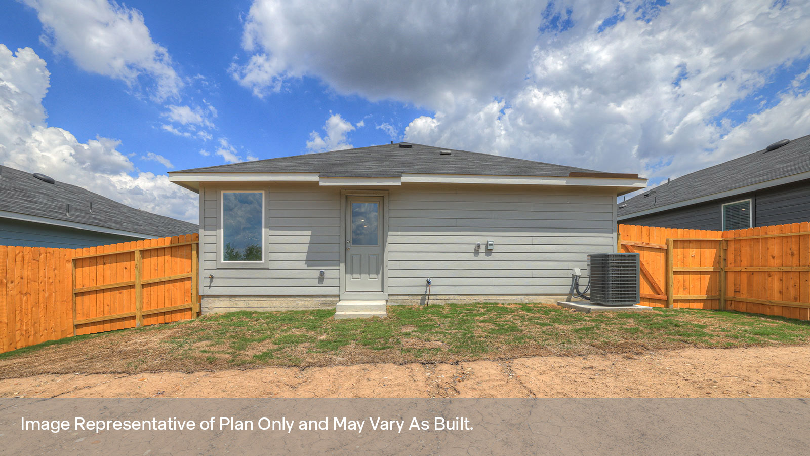 Backyard with sod and privacy fence.