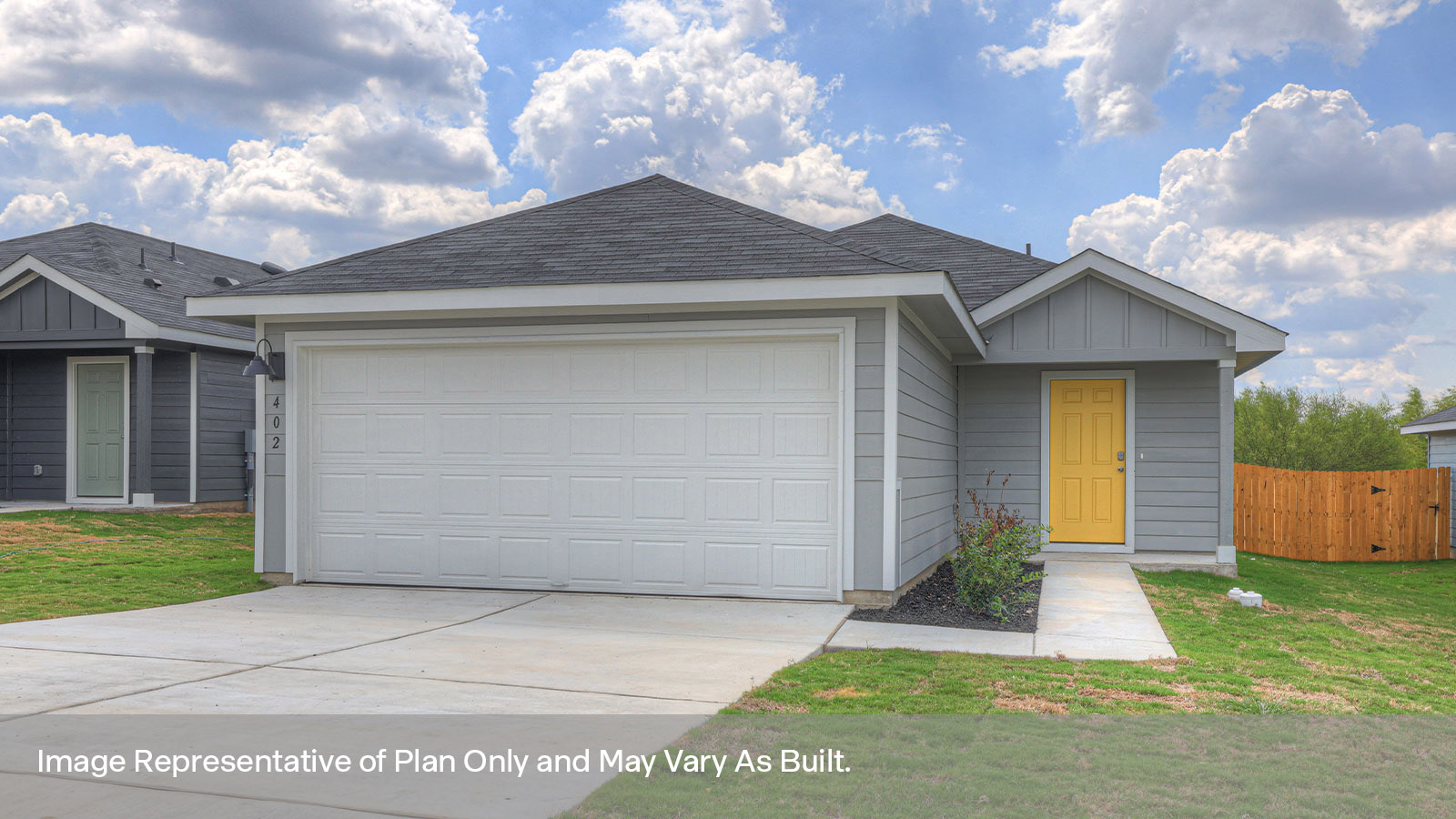 Single-story farmhouse with 2 car garage.
