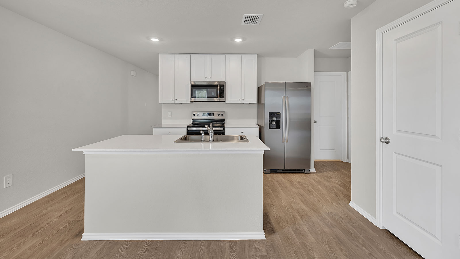 Kitchen with kitchen island and sink.