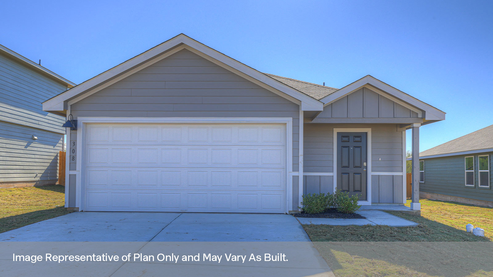 Single-story farmhouse with 2 car garage.