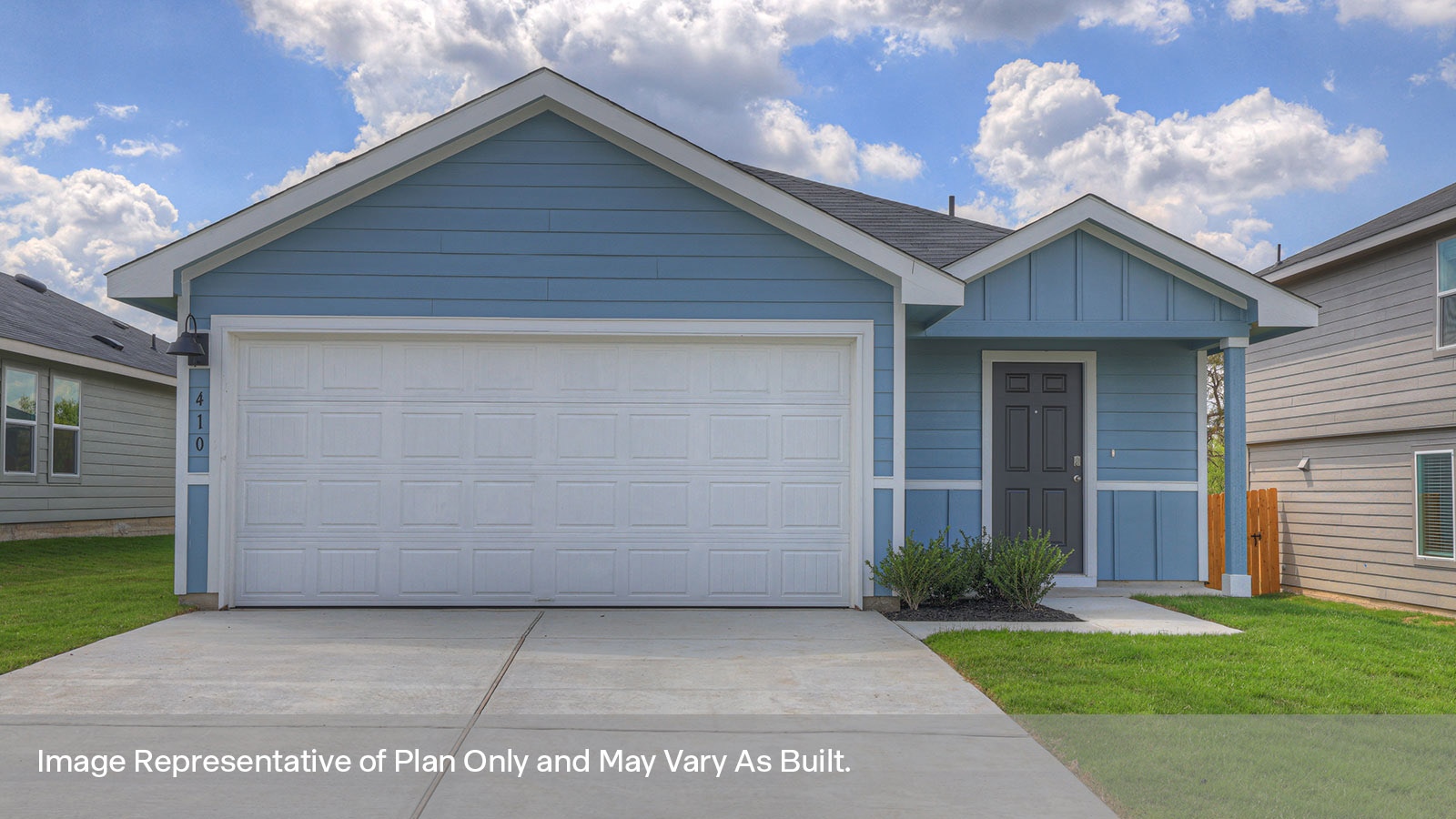 Single-story farmhouse with 2 car garage.